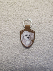Sample 22 | White dog keyring · full view
